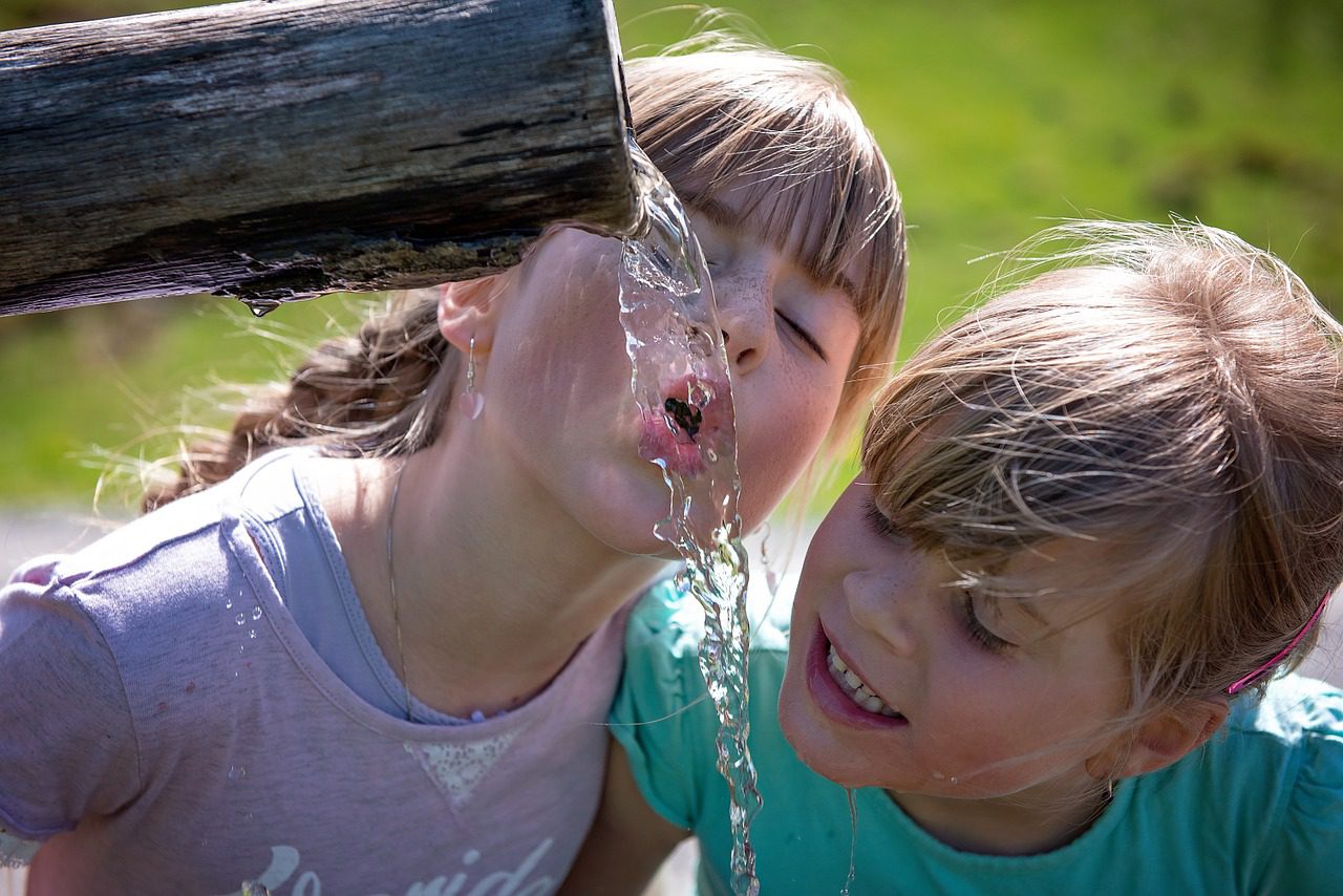 Children enjoying clean drinking water