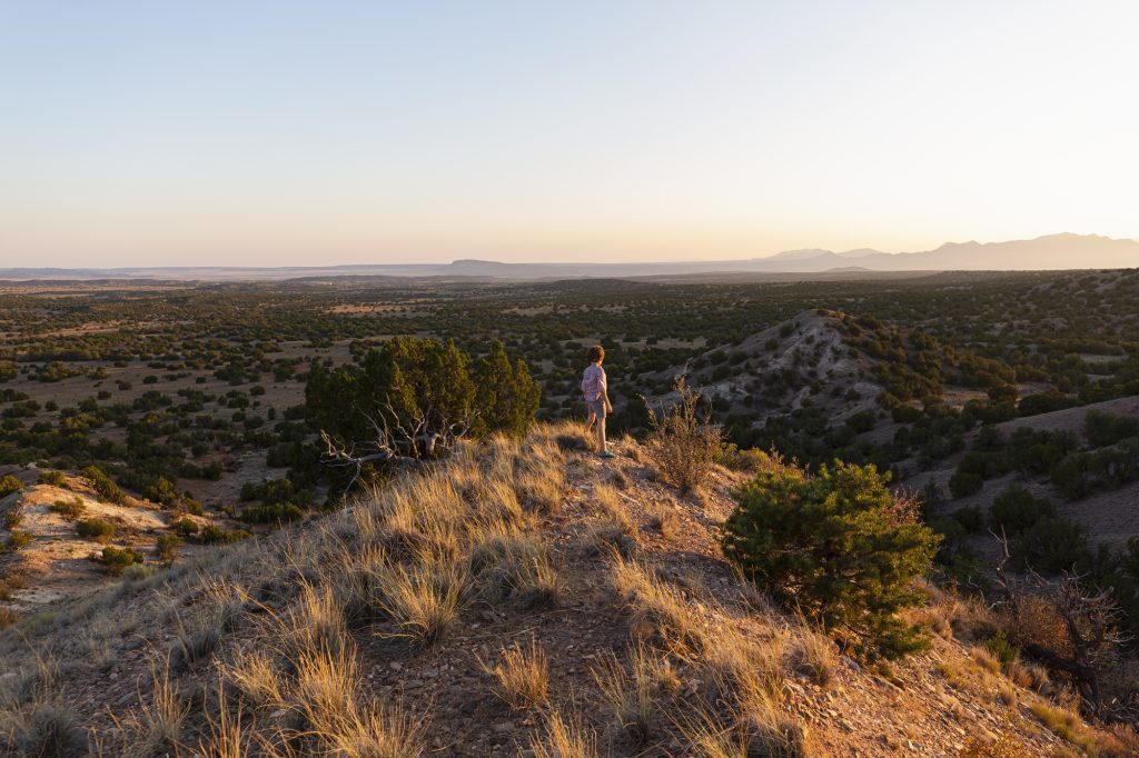 Young boy overlooking Gallisteo Basin, Santa Fe, New Mexico (Licensed Image)