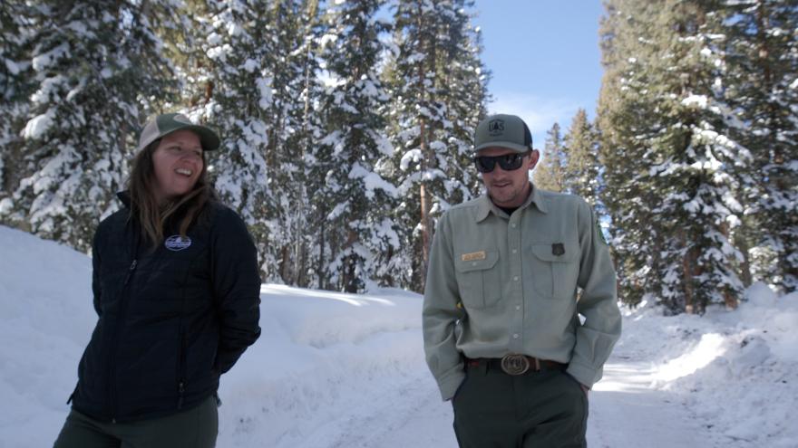 Hallie Flynn, forester with Colorado State Forest Service, and Kyle Rogers, timber sales administration with USDA Forest Service, discuss active timber management on the Grand Mesa National Forest. To improve conditions, crews are thinning dense areas, using prescribed fire and supporting commercial timber harvest. The goal is to reduce overcrowding, restore more a natural forest structure and give the ecosystems a better chance to withstand natural occurrences, including wildfire. (Forest Service photo by Travis Weger)
